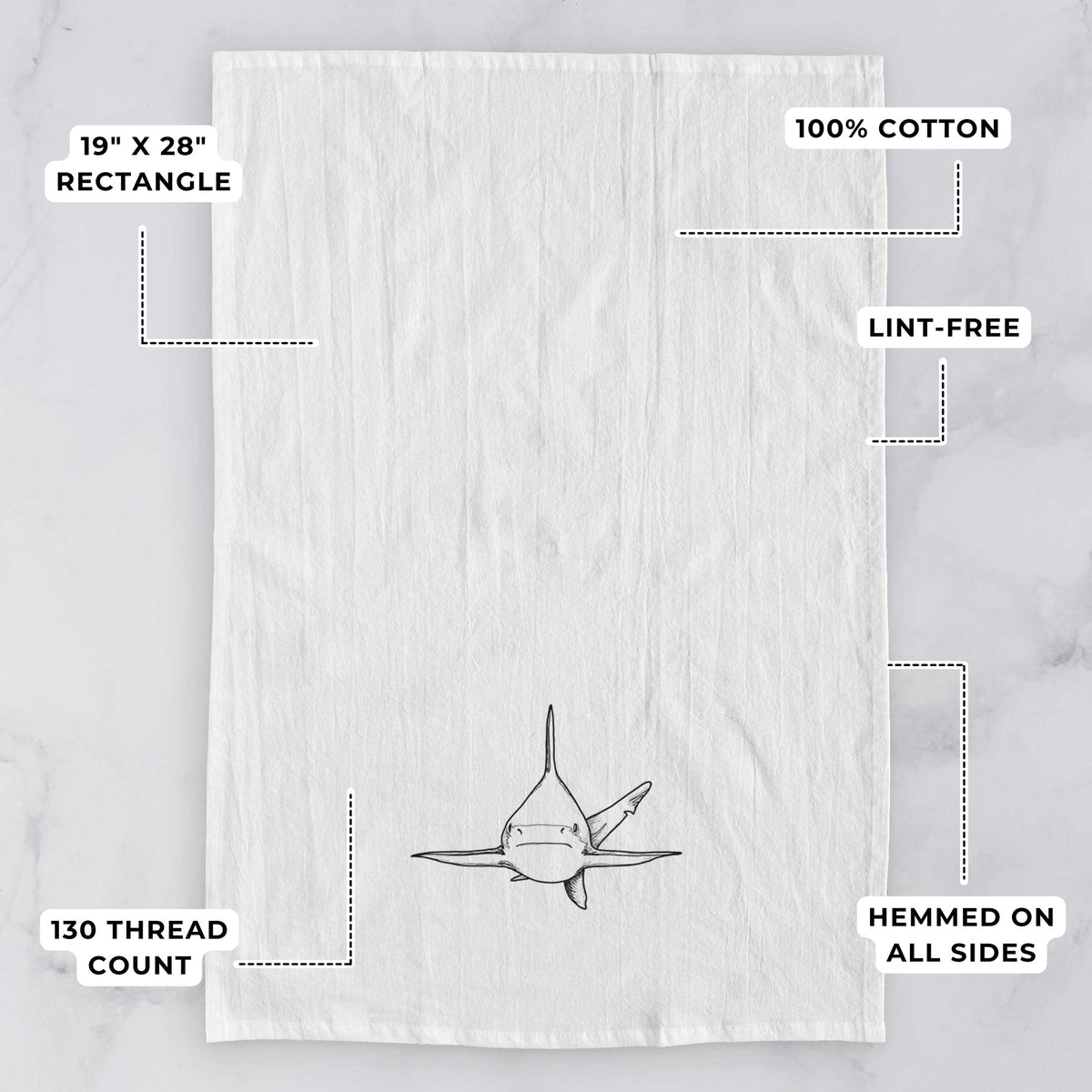 White tea towel printed with a black ink illustration of a silvertip shark swimming head-on, with feature labels: 19 by 28 inch rectangle, 100% cotton, lint-free, 130 thread count, hemmed on all sides.