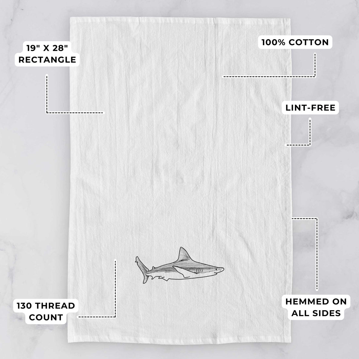 White tea towel printed with a black ink illustration of a silvertip shark swimming in profile, with feature labels: 19 by 28 inch rectangle, 100% cotton, lint-free, 130 thread count, hemmed on all sides.