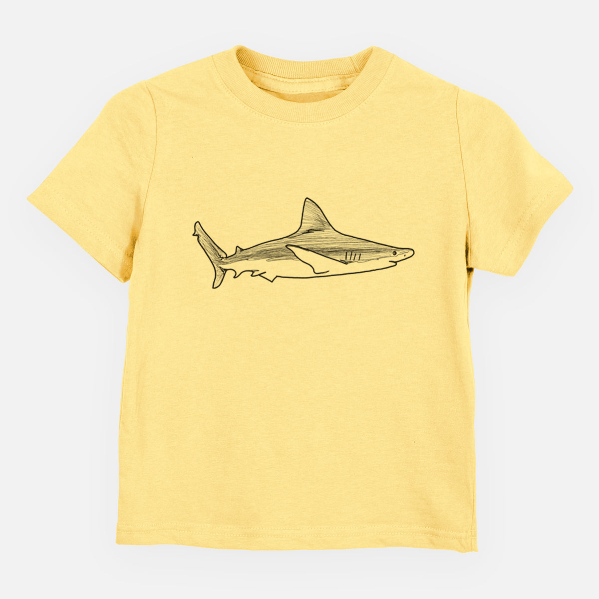 Butter yellow toddler t-shirt laid flat, printed with a black ink illustration of a silvertip shark swimming in profile.