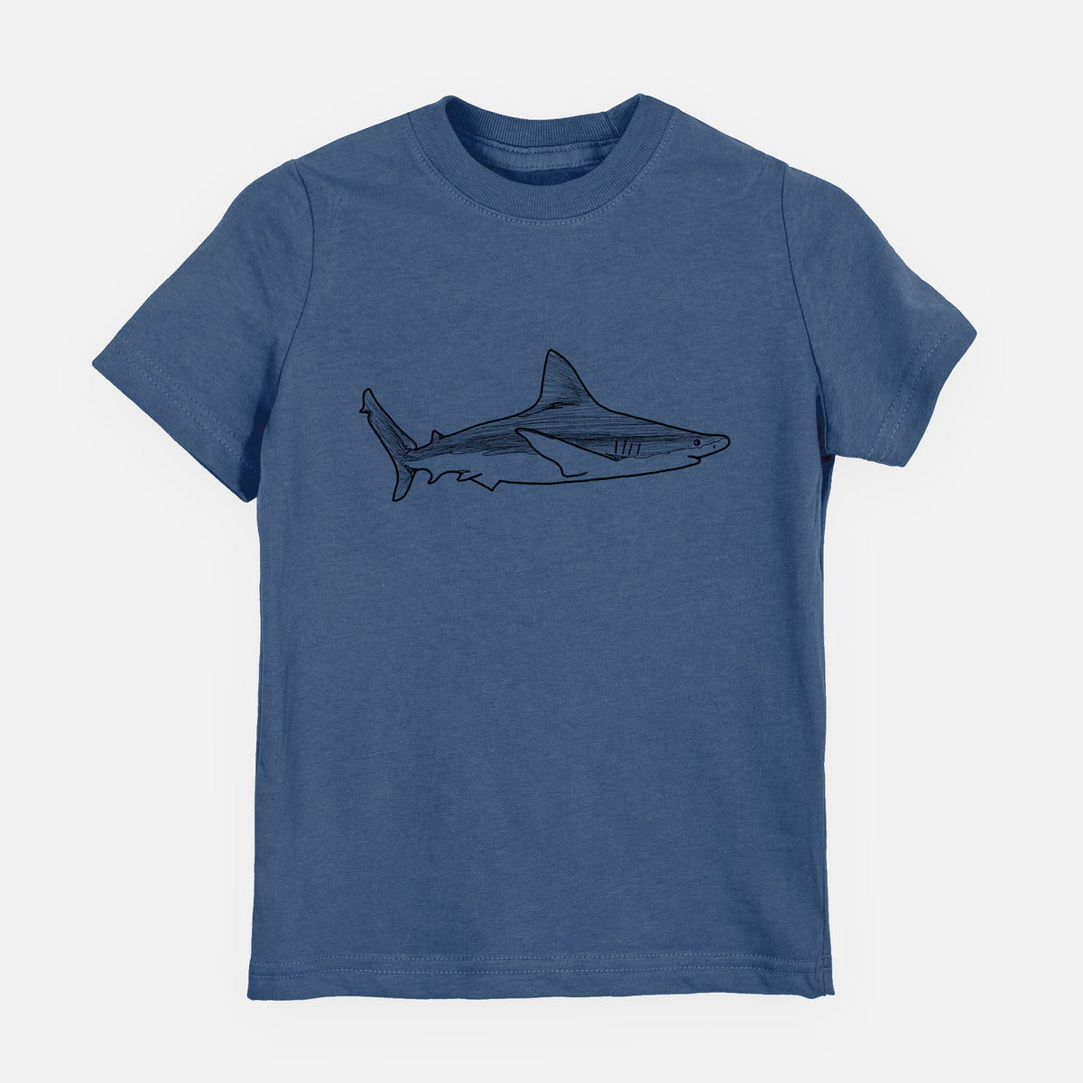 Indigo blue youth t-shirt laid flat, printed with a black ink illustration of a silvertip shark swimming in profile.