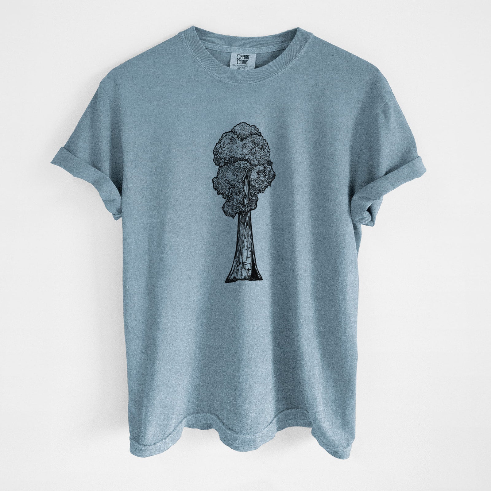 Blue jean Comfort Colors t-shirt laid flat, printed with a black ink illustration of a single giant sequoia tree.