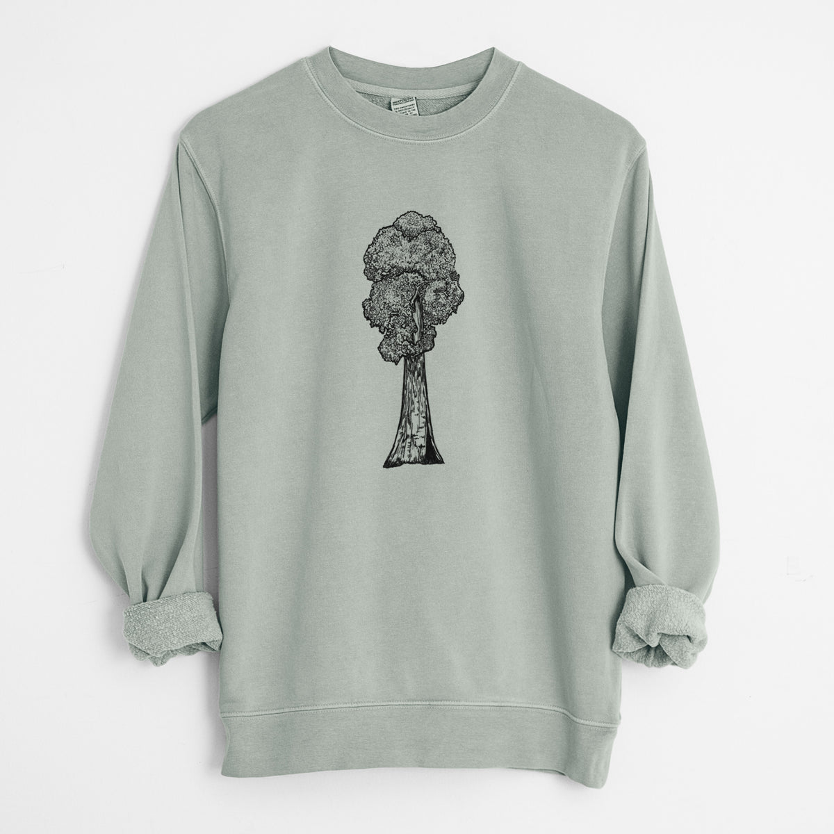 Sage green pigment dyed crewneck sweatshirt laid flat with the sleeves rolled, printed with a black ink illustration of a single giant sequoia tree.