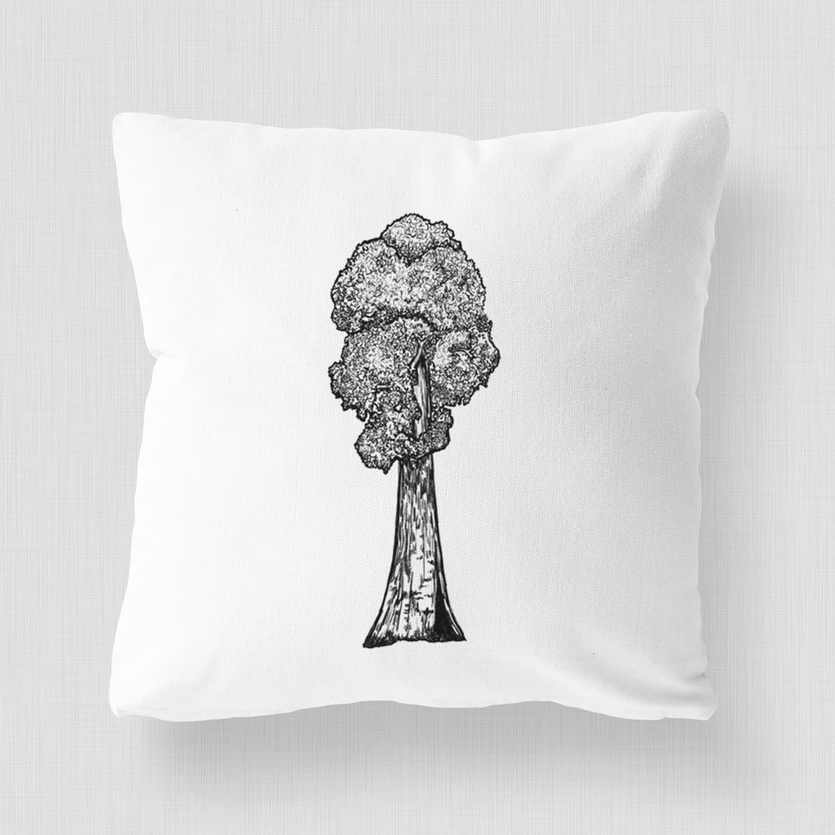 White pillow cover printed with a black ink illustration of a single giant sequoia tree.