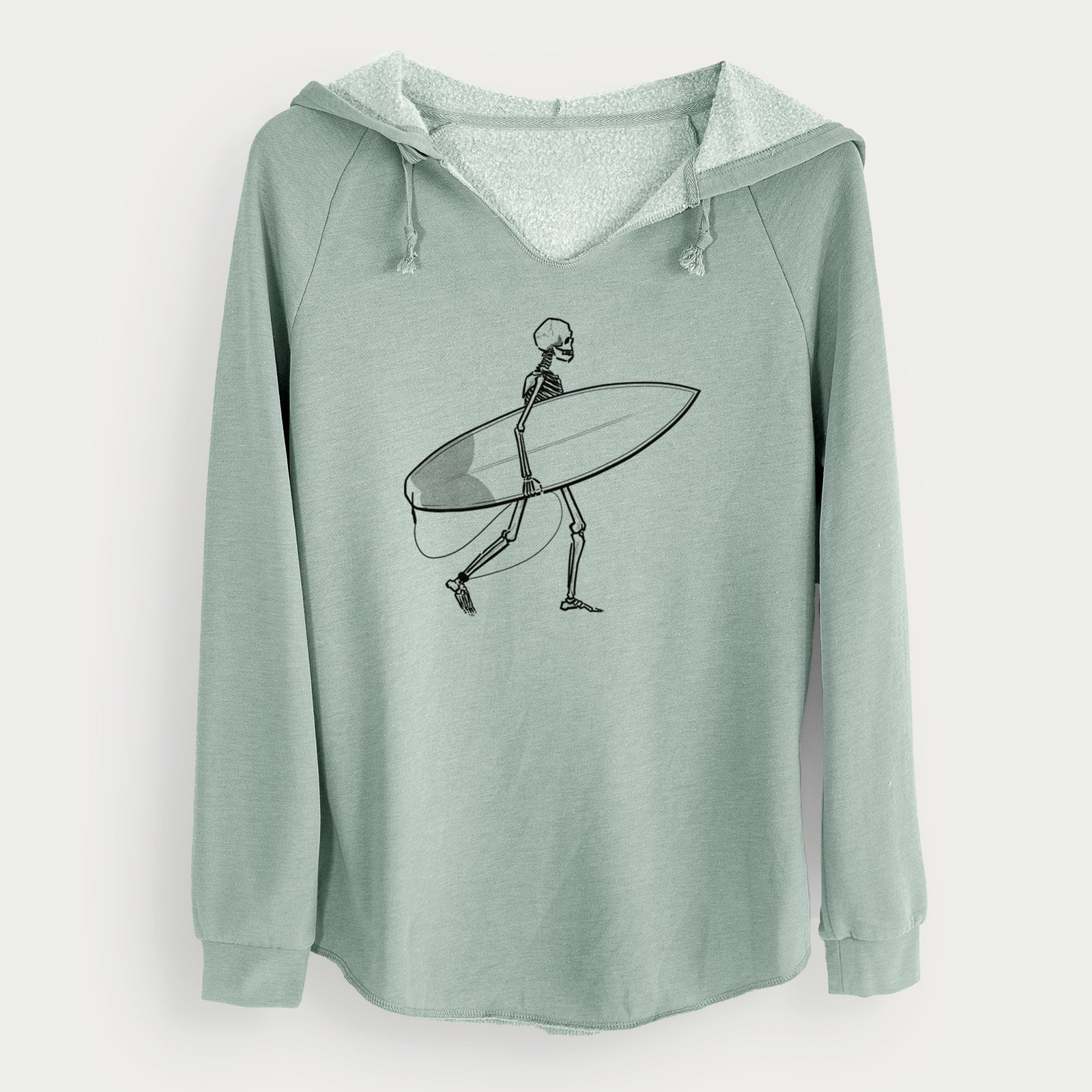 Sage green women's Cali Wave hooded sweatshirt laid flat, printed with a black ink skeleton walking while carrying a surfboard.