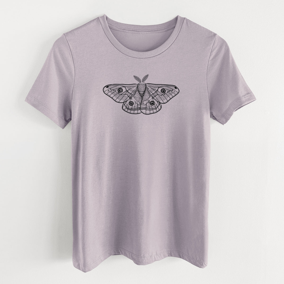 Light violet women's relaxed fit cotton t-shirt laid flat, printed with a detailed black ink illustration of a small emperor moth with eyespots on its wings.