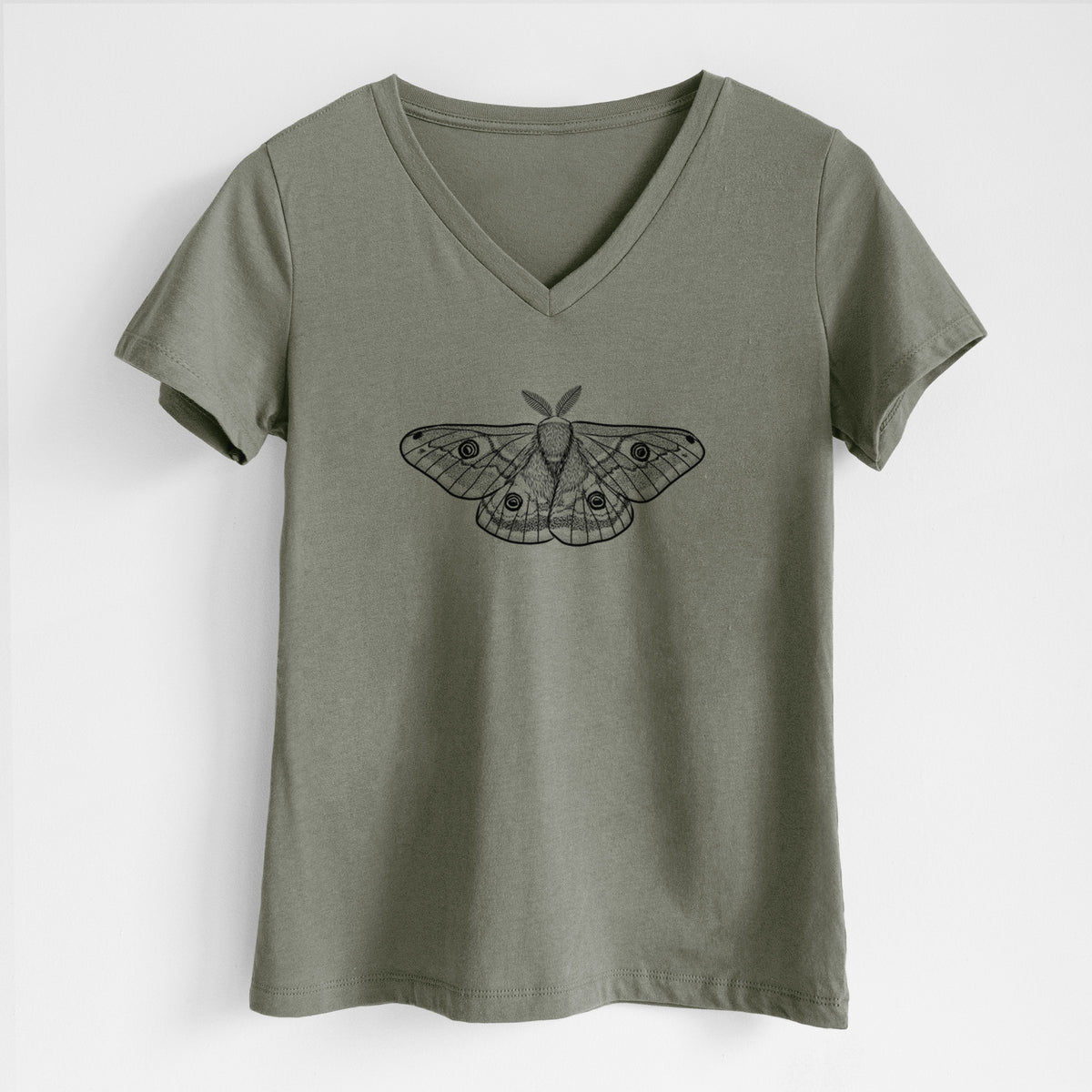 Military green women's relaxed fit cotton V-neck t-shirt laid flat, printed with a detailed black ink illustration of a small emperor moth with eyespots on its wings.