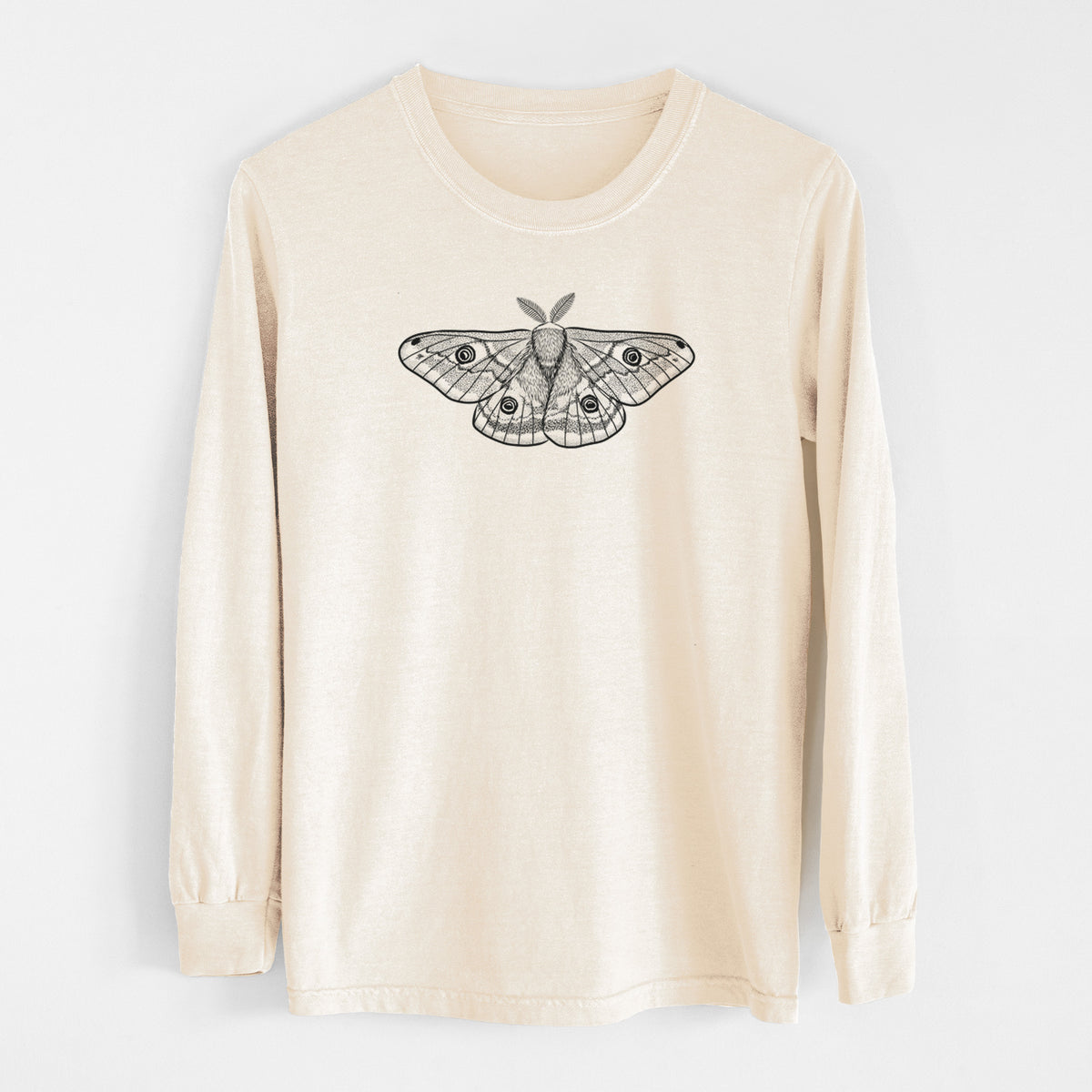 Ivory Comfort Colors long sleeve shirt laid flat, printed with a detailed black ink illustration of a small emperor moth with eyespots on its wings.