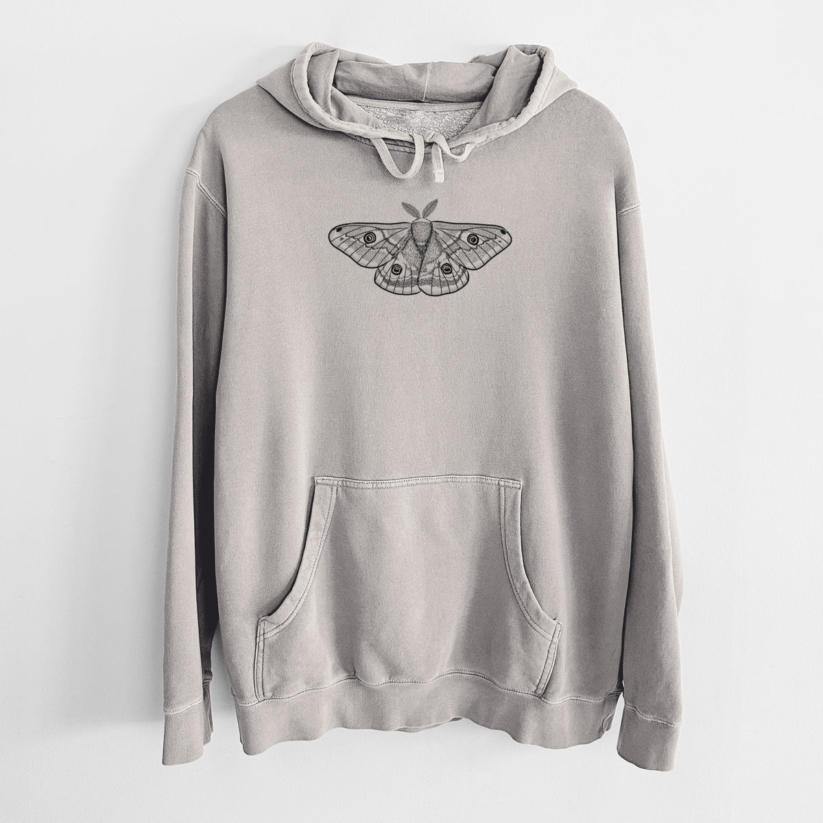 Cement grey pigment dyed hoodie laid flat, printed with a detailed black ink illustration of a small emperor moth with eyespots on its wings.