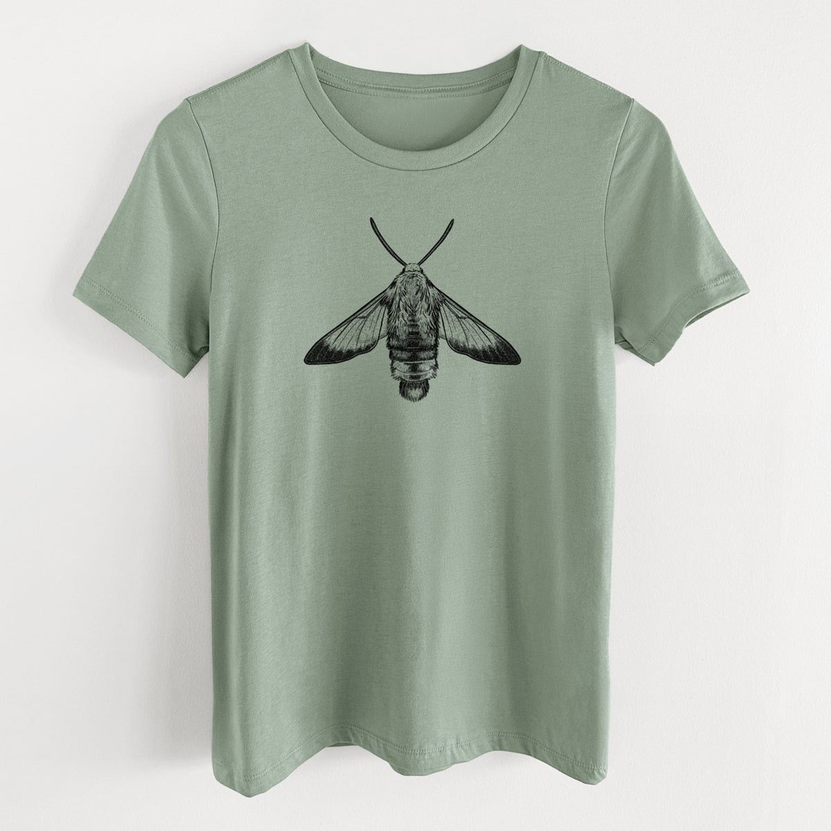 Sage green women's relaxed fit cotton t-shirt laid flat, printed with a detailed black ink illustration of a snowberry clearwing moth, seen from above.