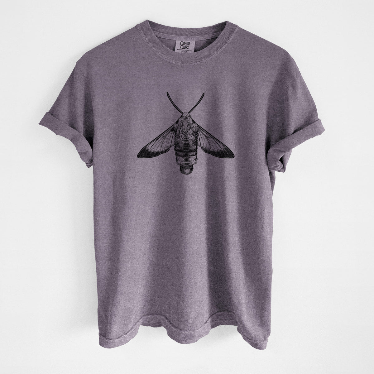 Wine red Comfort Colors t-shirt laid flat, printed with a detailed black ink illustration of a snowberry clearwing moth, seen from above.