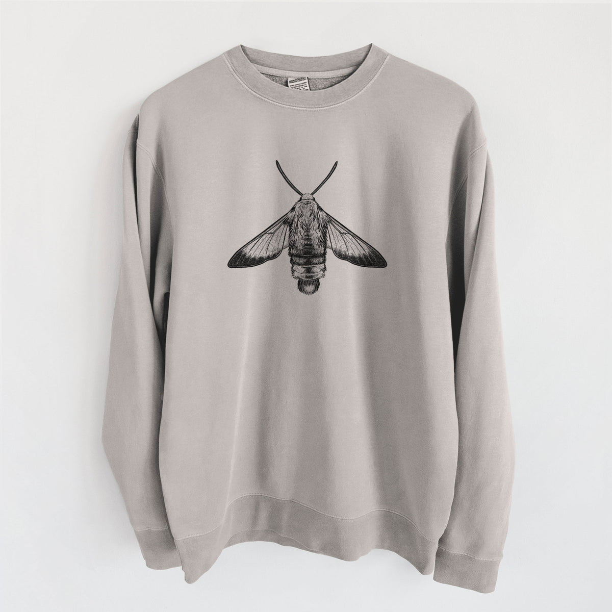 Cement grey pigment dyed crewneck sweatshirt laid flat, printed with a detailed black ink illustration of a snowberry clearwing moth, seen from above.