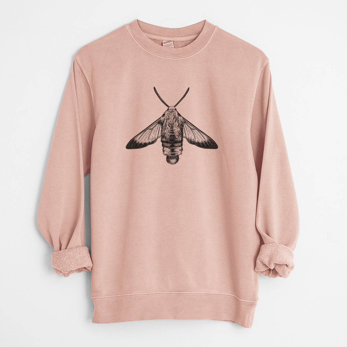 Dusty pink pigment dyed crewneck sweatshirt laid flat with the sleeves rolled, printed with a detailed black ink illustration of a snowberry clearwing moth, seen from above.