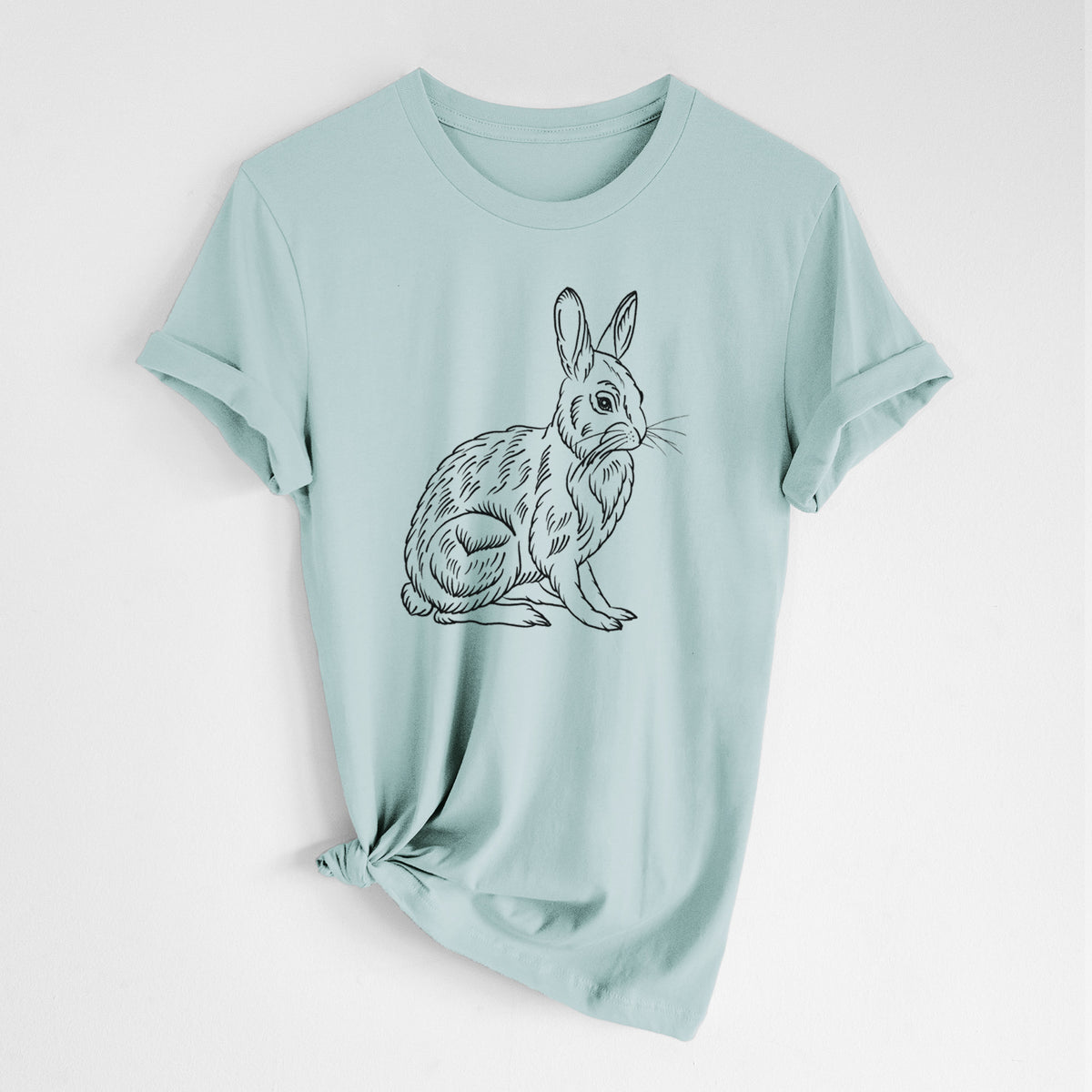 Dusty blue lightweight cotton t-shirt laid flat with the sleeves rolled, printed with a detailed black ink illustration of a snowshoe hare sitting upright.