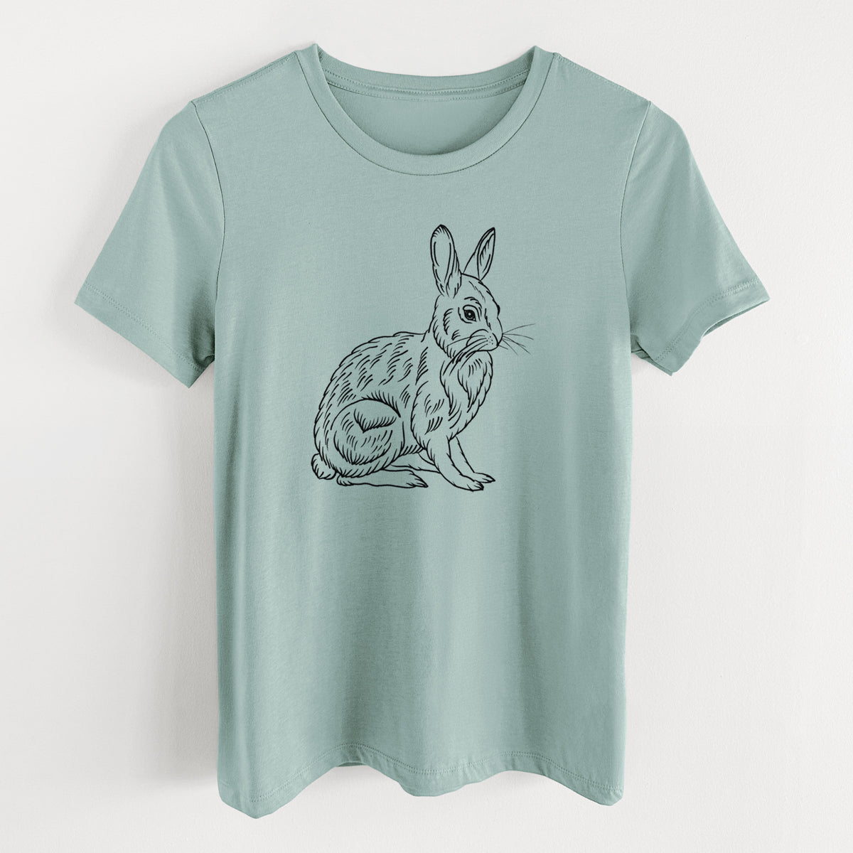 Dusty blue women's relaxed fit cotton t-shirt laid flat, printed with a detailed black ink illustration of a snowshoe hare sitting upright.