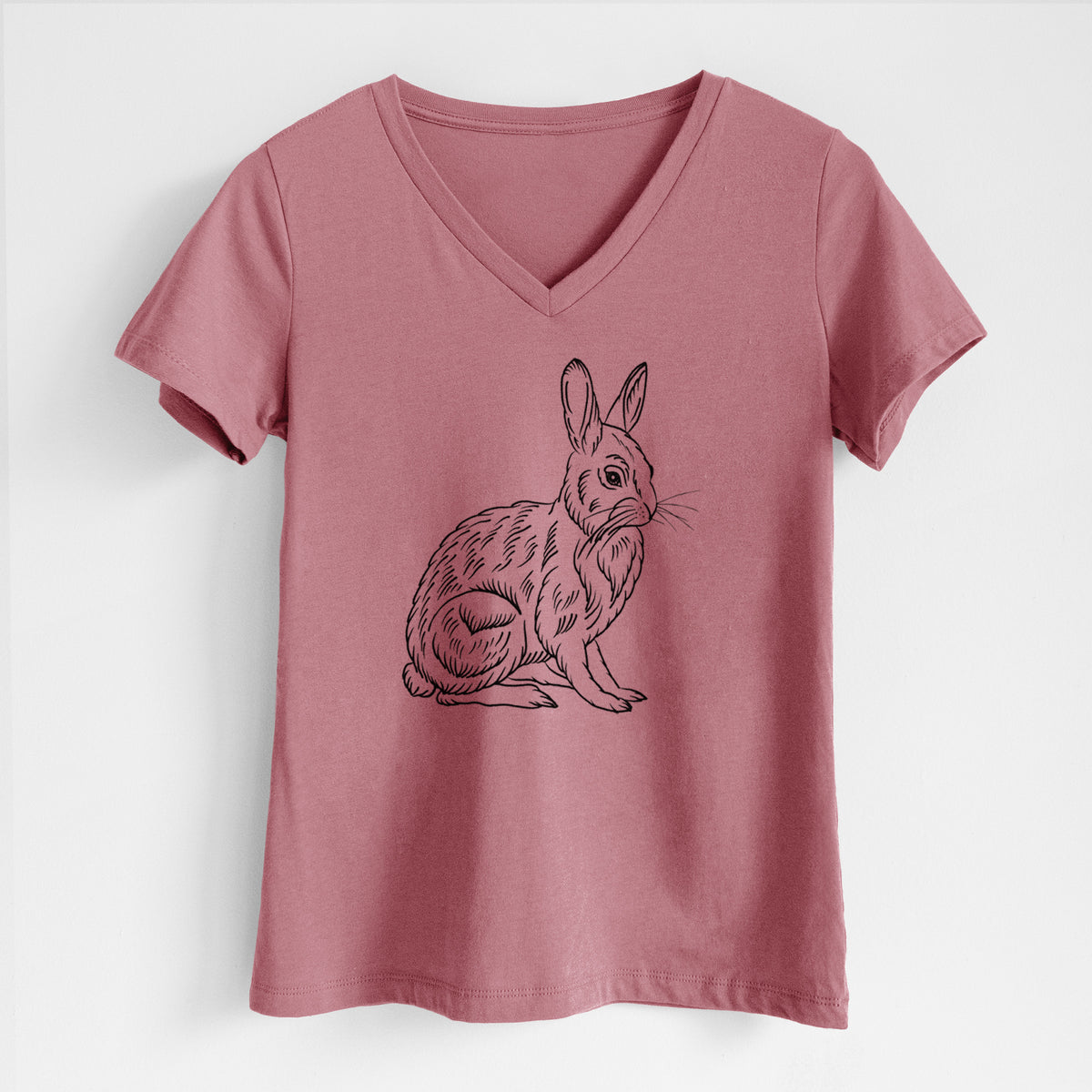Mauve pink women's relaxed fit cotton V-neck t-shirt laid flat, printed with a detailed black ink illustration of a snowshoe hare sitting upright.