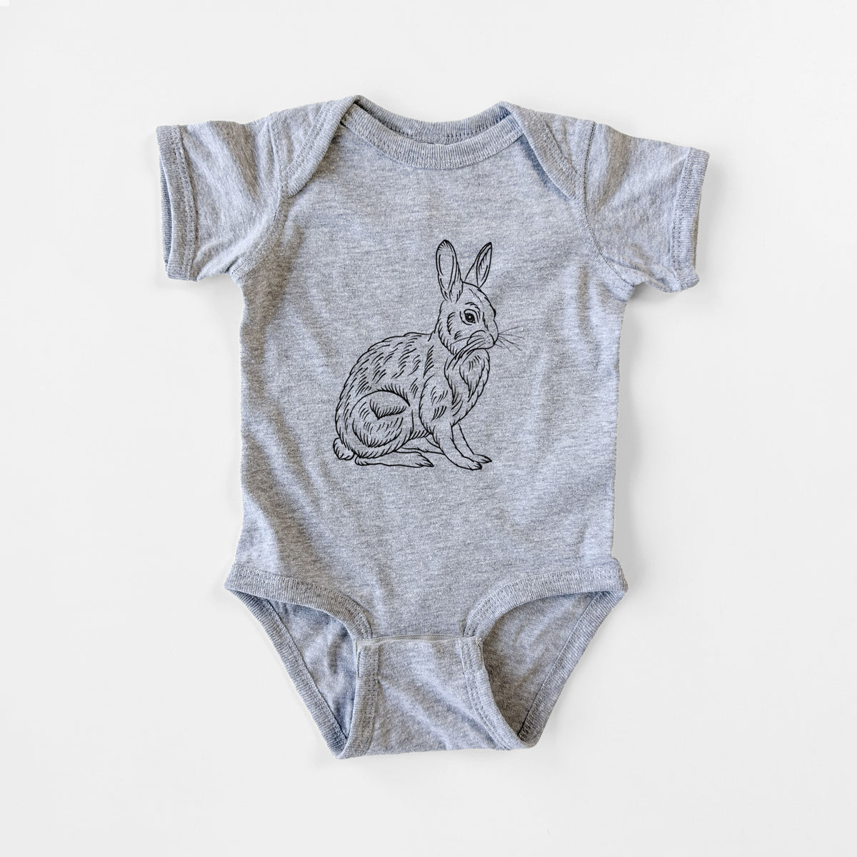 Grey baby bodysuit laid flat, printed with a detailed black ink illustration of a snowshoe hare sitting upright.