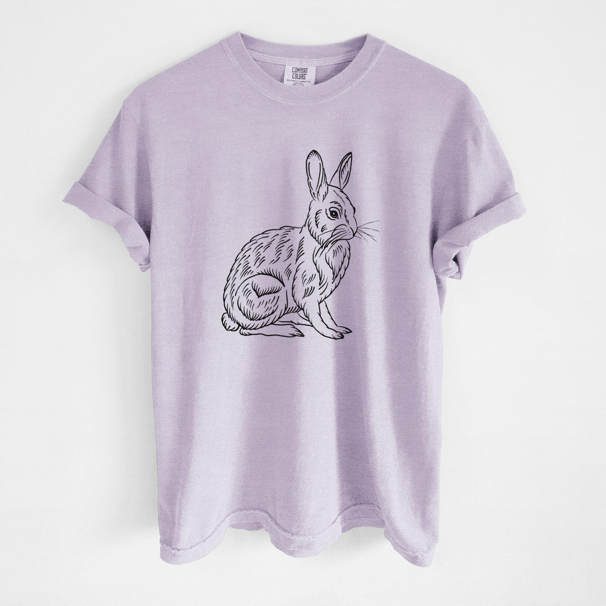 Orchid purple Comfort Colors t-shirt laid flat, printed with a detailed black ink illustration of a snowshoe hare sitting upright.
