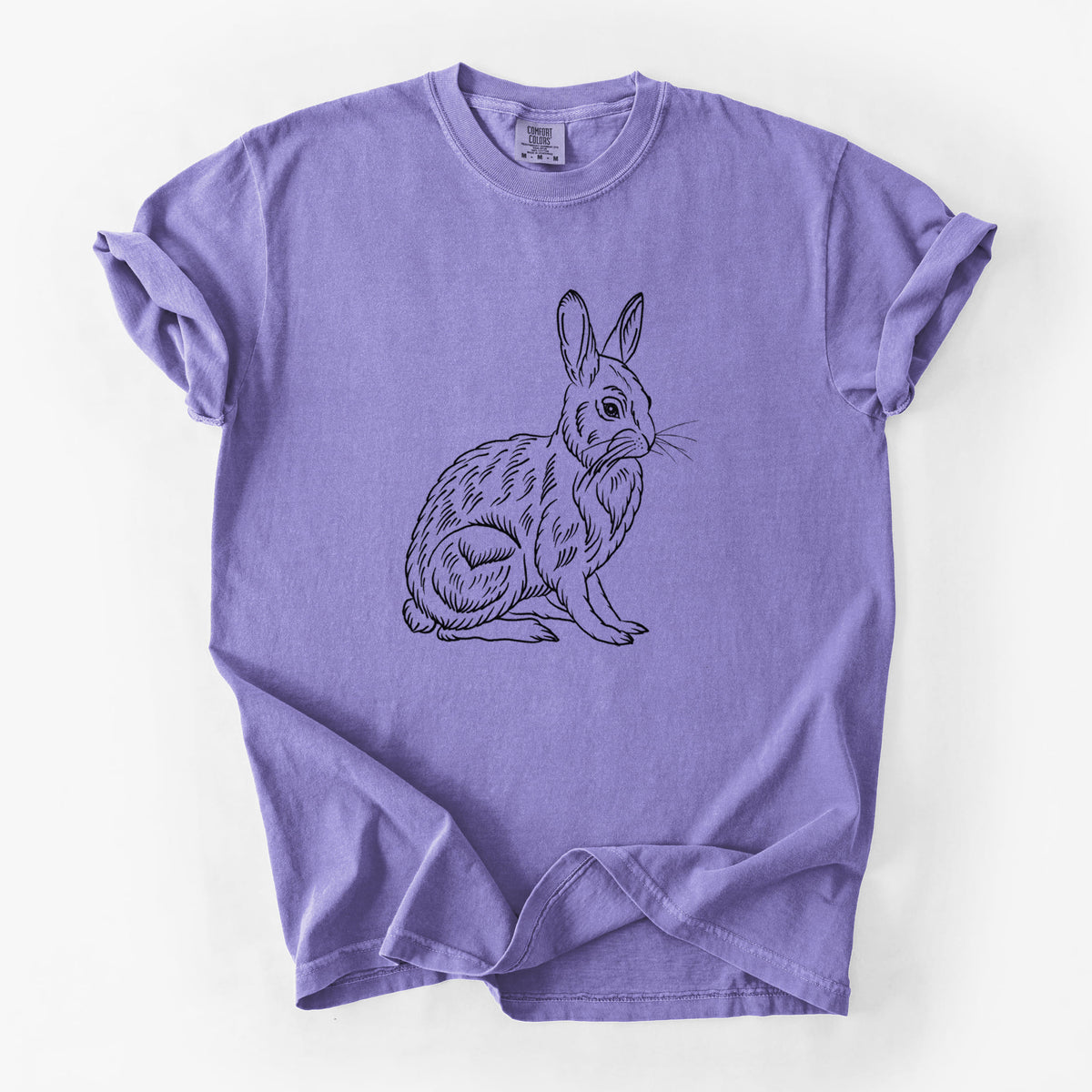 Violet purple Comfort Colors t-shirt laid flat, printed with a detailed black ink illustration of a snowshoe hare sitting upright.