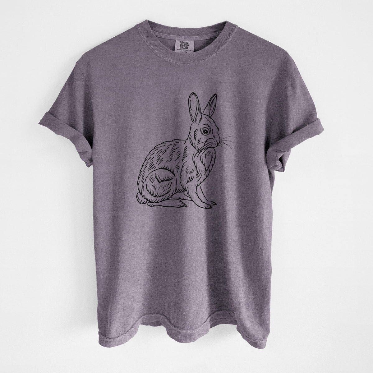 Wine red Comfort Colors t-shirt laid flat, printed with a detailed black ink illustration of a snowshoe hare sitting upright.