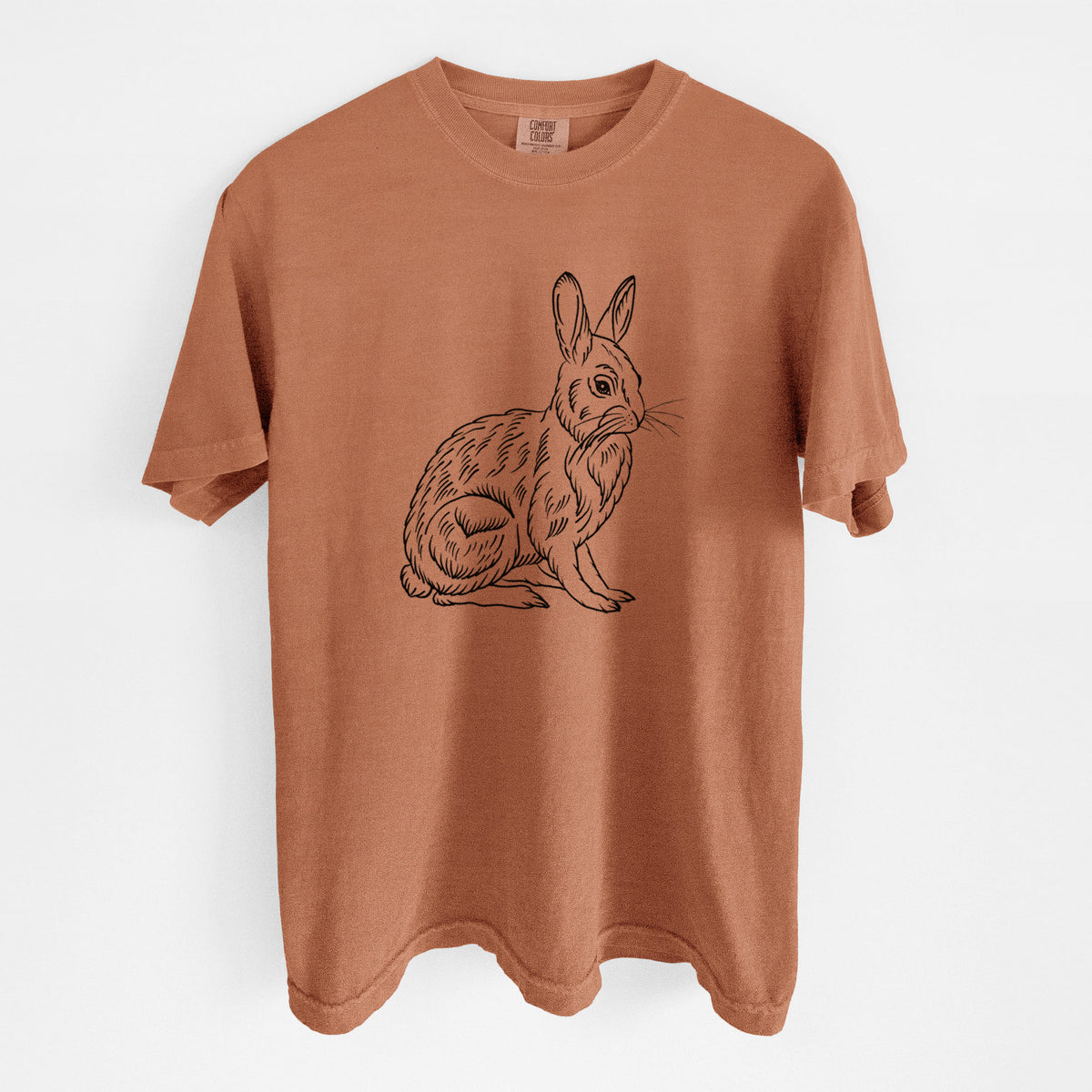 Yam burnt orange Comfort Colors t-shirt laid flat, printed with a detailed black ink illustration of a snowshoe hare sitting upright.