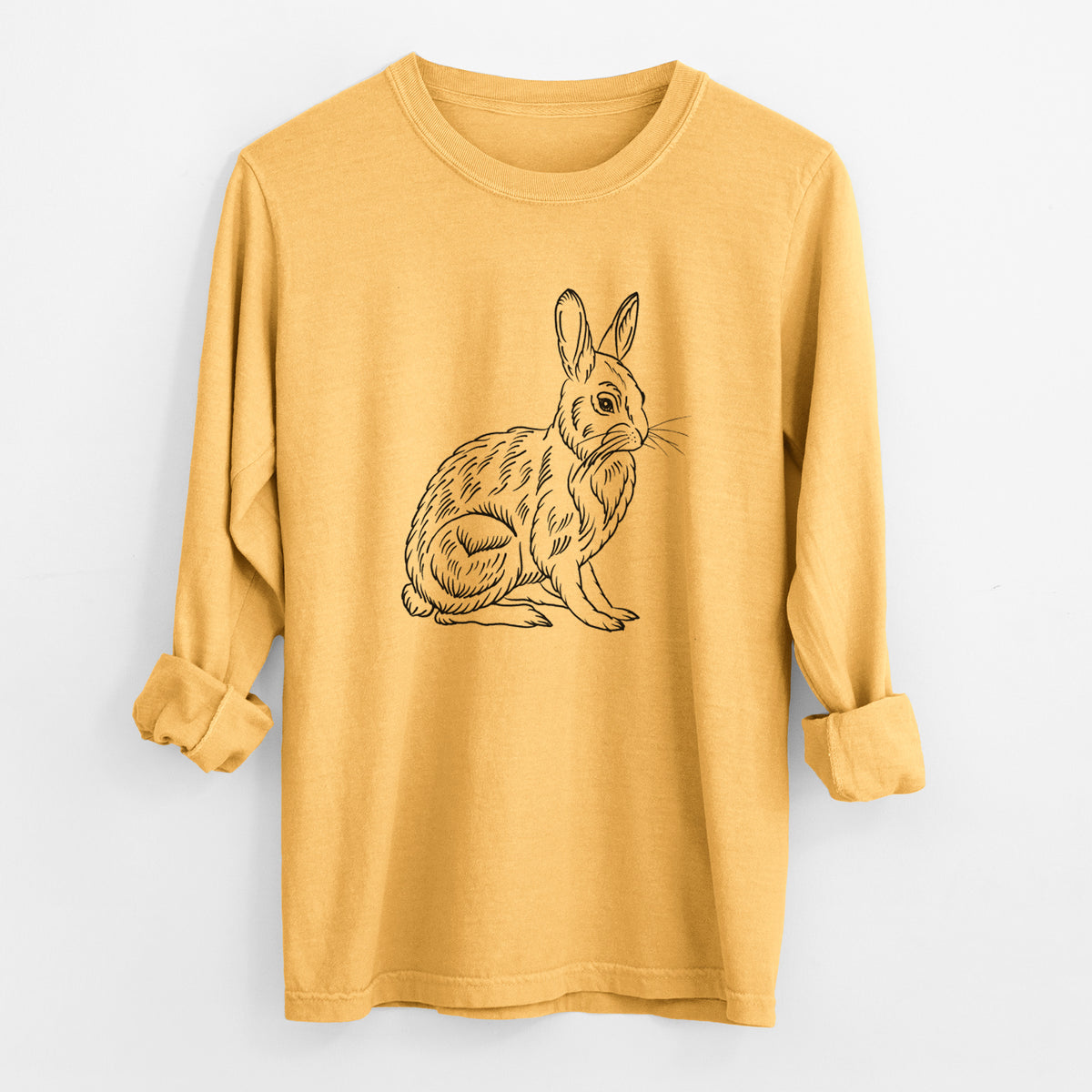 Golden wheat yellow Comfort Colors long sleeve shirt laid flat with the cuffs rolled, printed with a detailed black ink illustration of a snowshoe hare sitting upright.