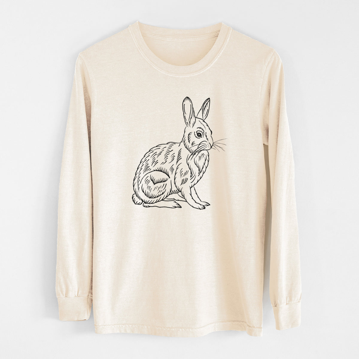 Ivory Comfort Colors long sleeve shirt laid flat, printed with a detailed black ink illustration of a snowshoe hare sitting upright.