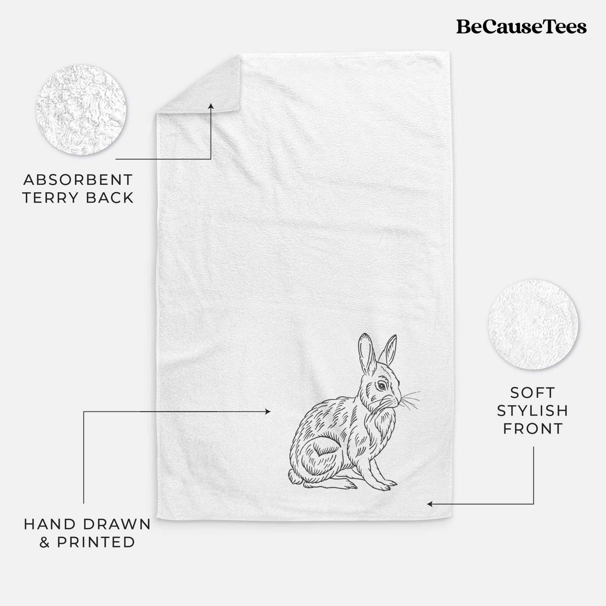 White hand towel printed with a detailed black ink illustration of a snowshoe hare sitting upright.