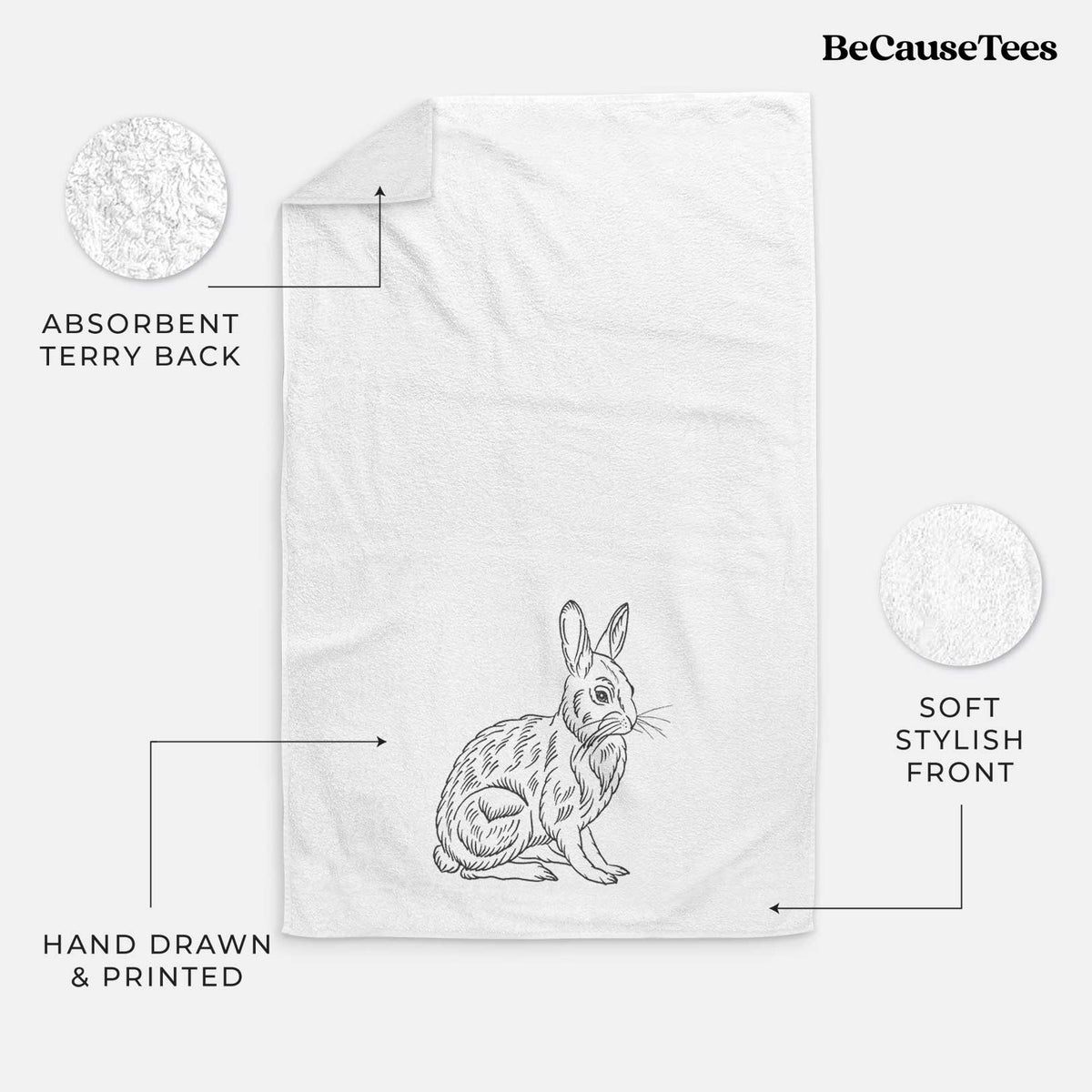 White hand towel printed with a detailed black ink illustration of a snowshoe hare sitting upright.