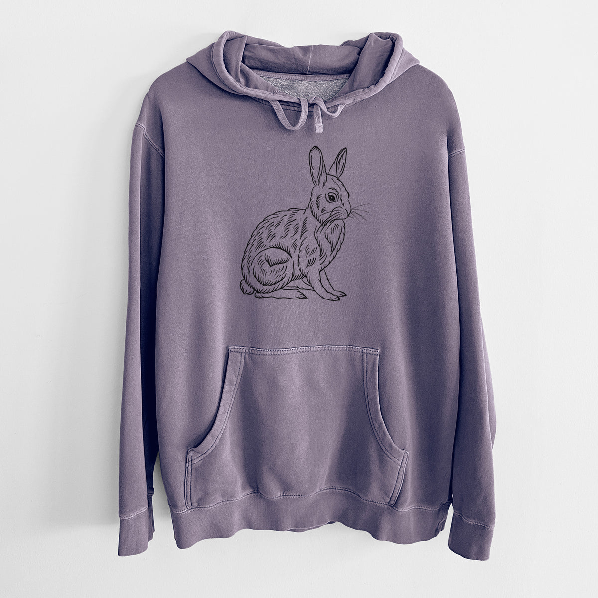 Plum purple pigment dyed hoodie laid flat, printed with a detailed black ink illustration of a snowshoe hare sitting upright.