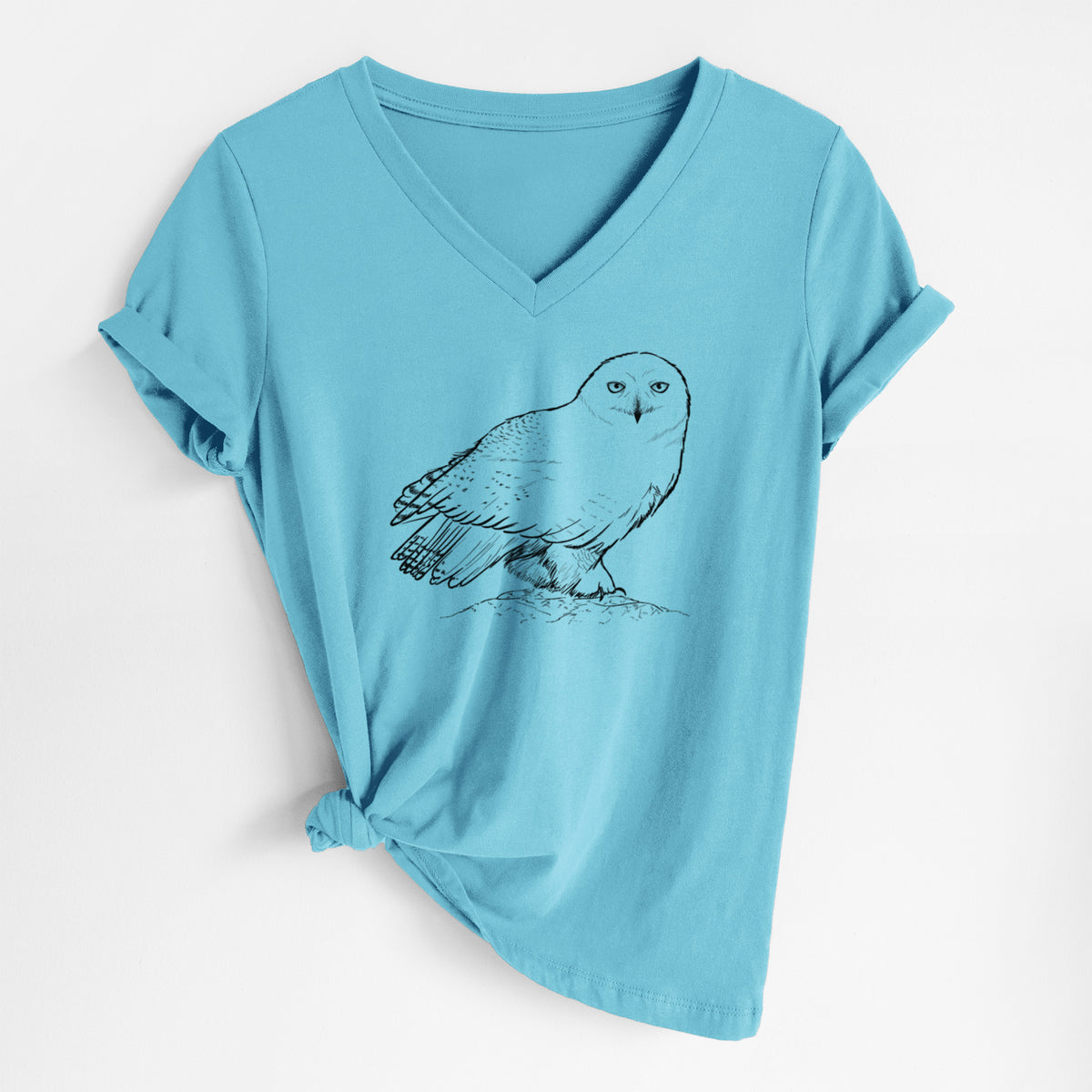 Turquoise women's relaxed fit cotton V-neck t-shirt laid flat, printed with a detailed black ink illustration of a snowy owl perched on a snowy mound.