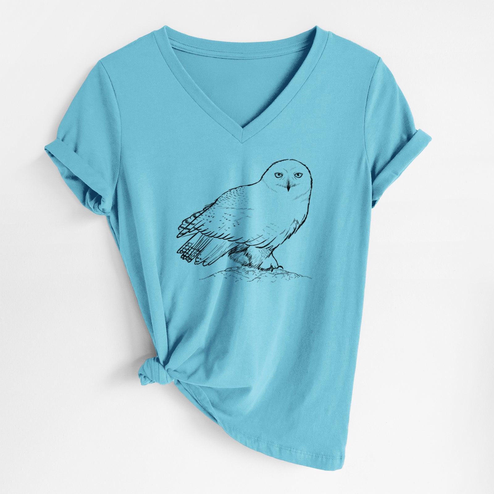 Turquoise women's relaxed fit cotton V-neck t-shirt laid flat, printed with a detailed black ink illustration of a snowy owl perched on a snowy mound.