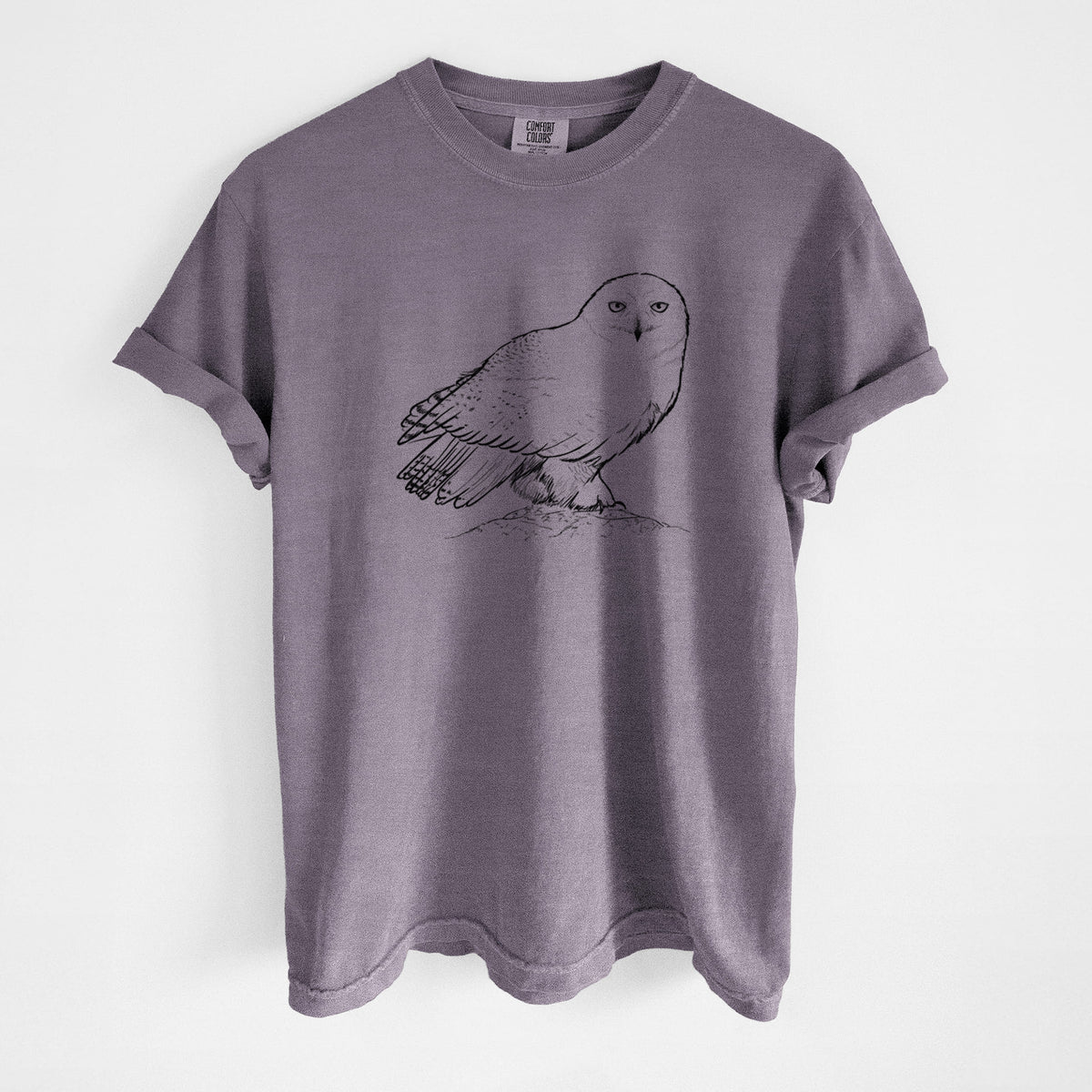 Wine red Comfort Colors t-shirt laid flat, printed with a detailed black ink illustration of a snowy owl perched on a snowy mound.