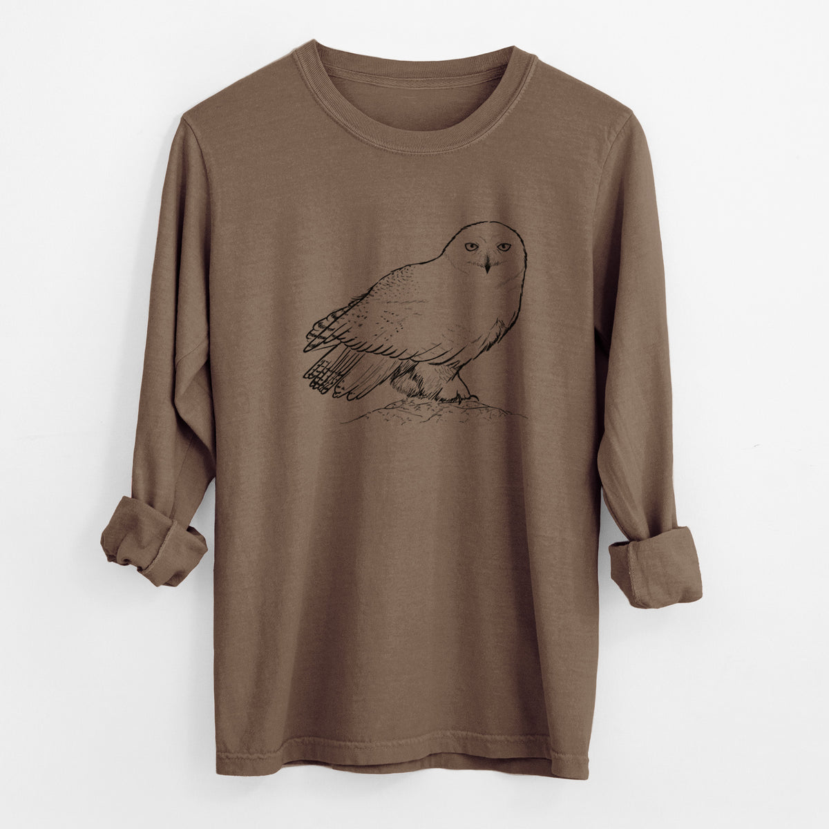 Espresso brown Comfort Colors long sleeve shirt laid flat with the cuffs rolled, printed with a detailed black ink illustration of a snowy owl perched on a snowy mound.