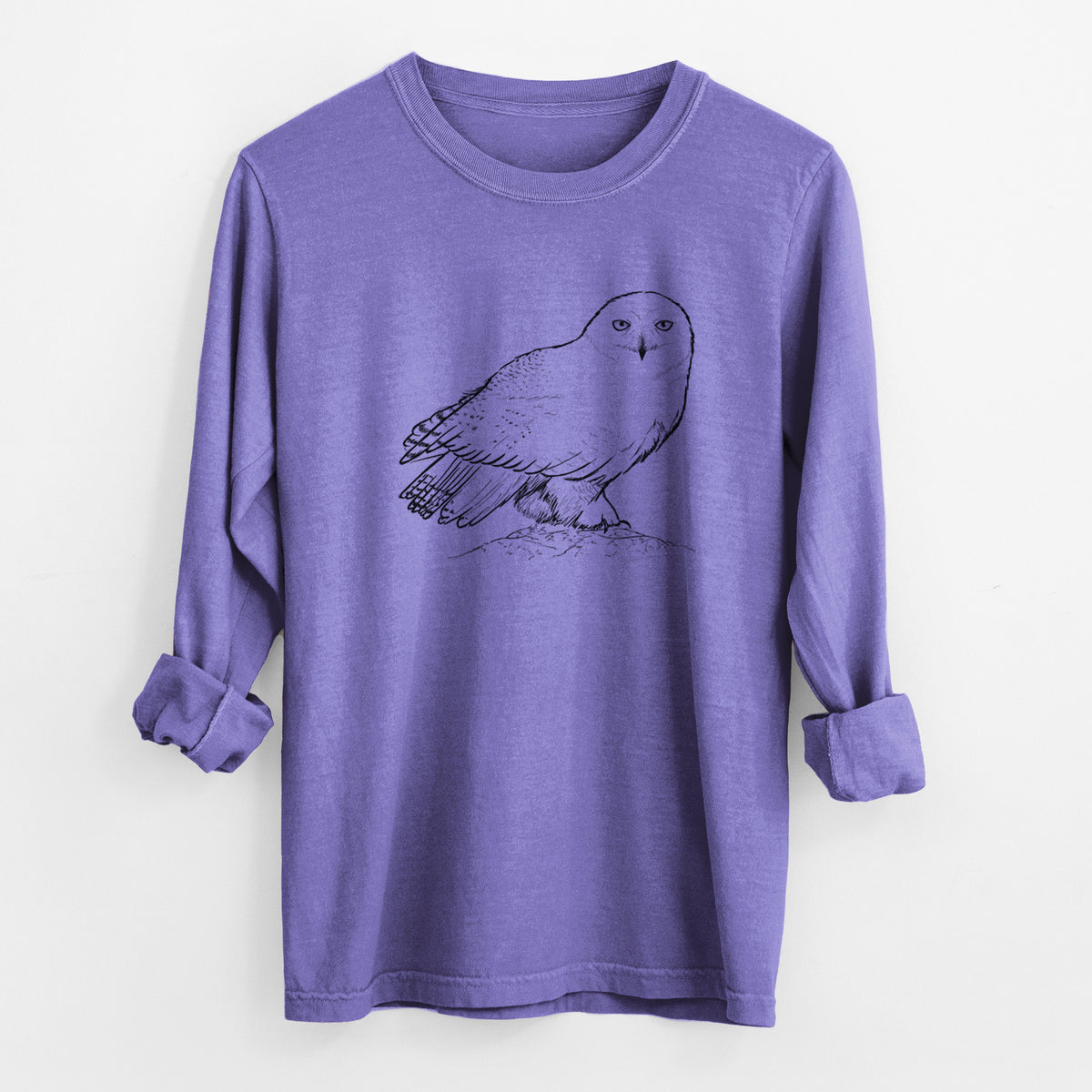 Violet purple Comfort Colors long sleeve shirt laid flat with the cuffs rolled, printed with a detailed black ink illustration of a snowy owl perched on a snowy mound.