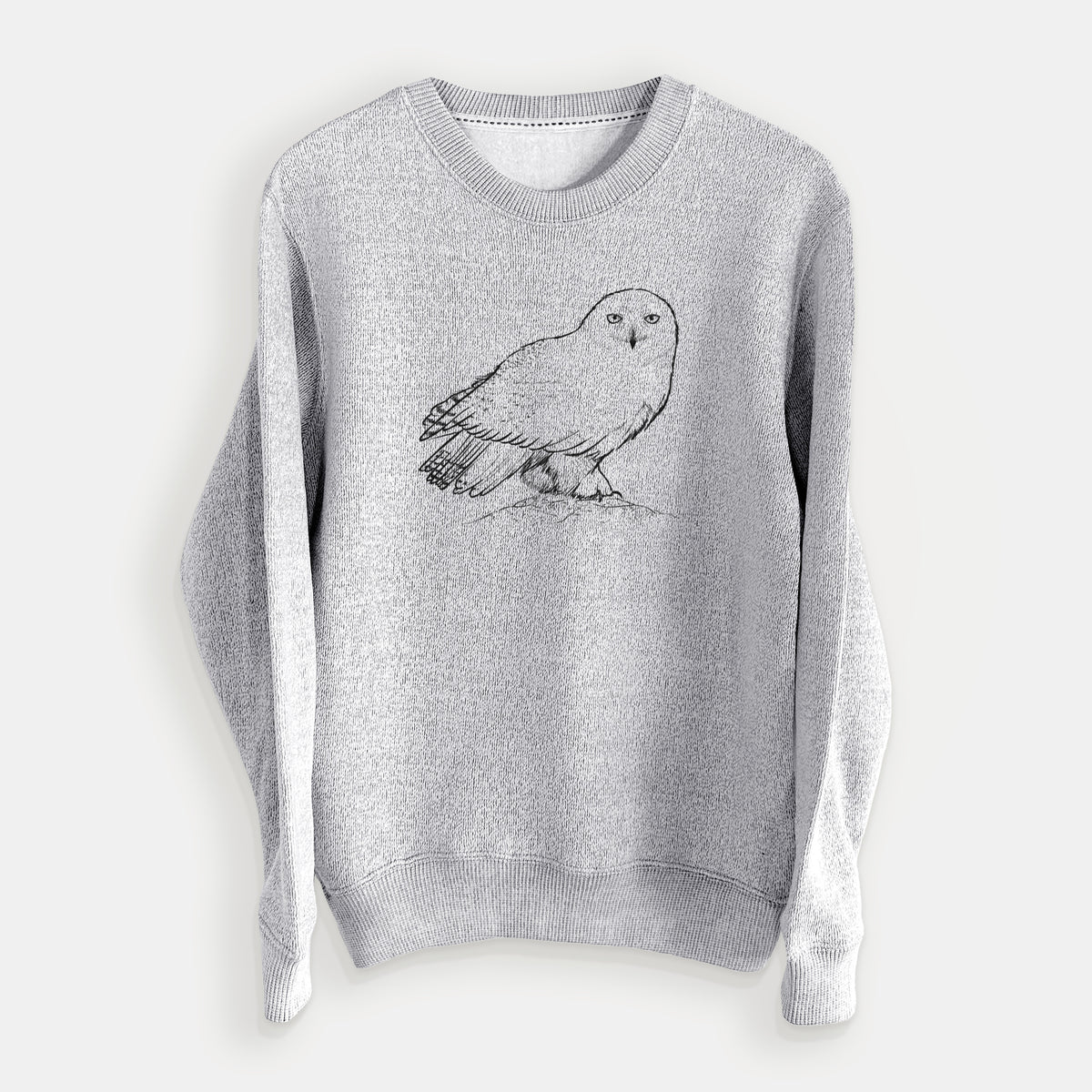 Salt and pepper knit sweatshirt laid flat, printed with a detailed black ink illustration of a snowy owl perched on a snowy mound.
