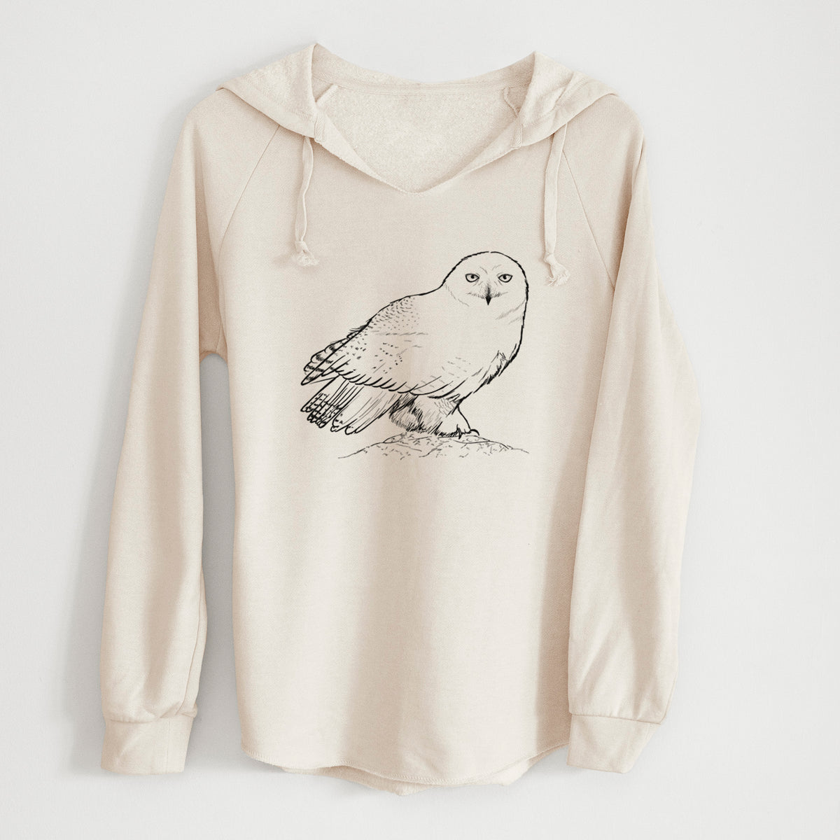 Bone cream women's Cali Wave hooded sweatshirt laid flat, printed with a detailed black ink illustration of a snowy owl perched on a snowy mound.