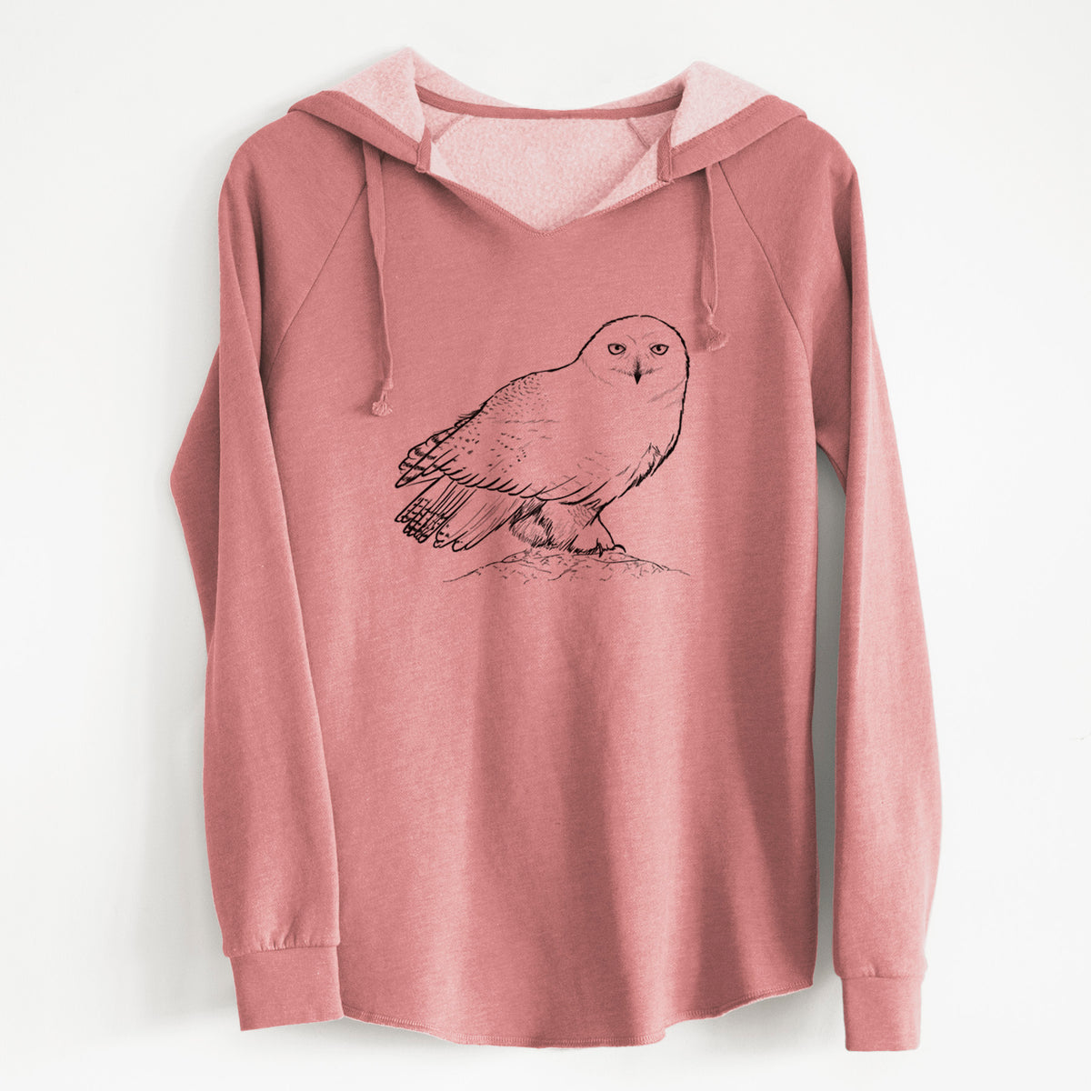 Dusty rose women's Cali Wave hooded sweatshirt laid flat, printed with a detailed black ink illustration of a snowy owl perched on a snowy mound.