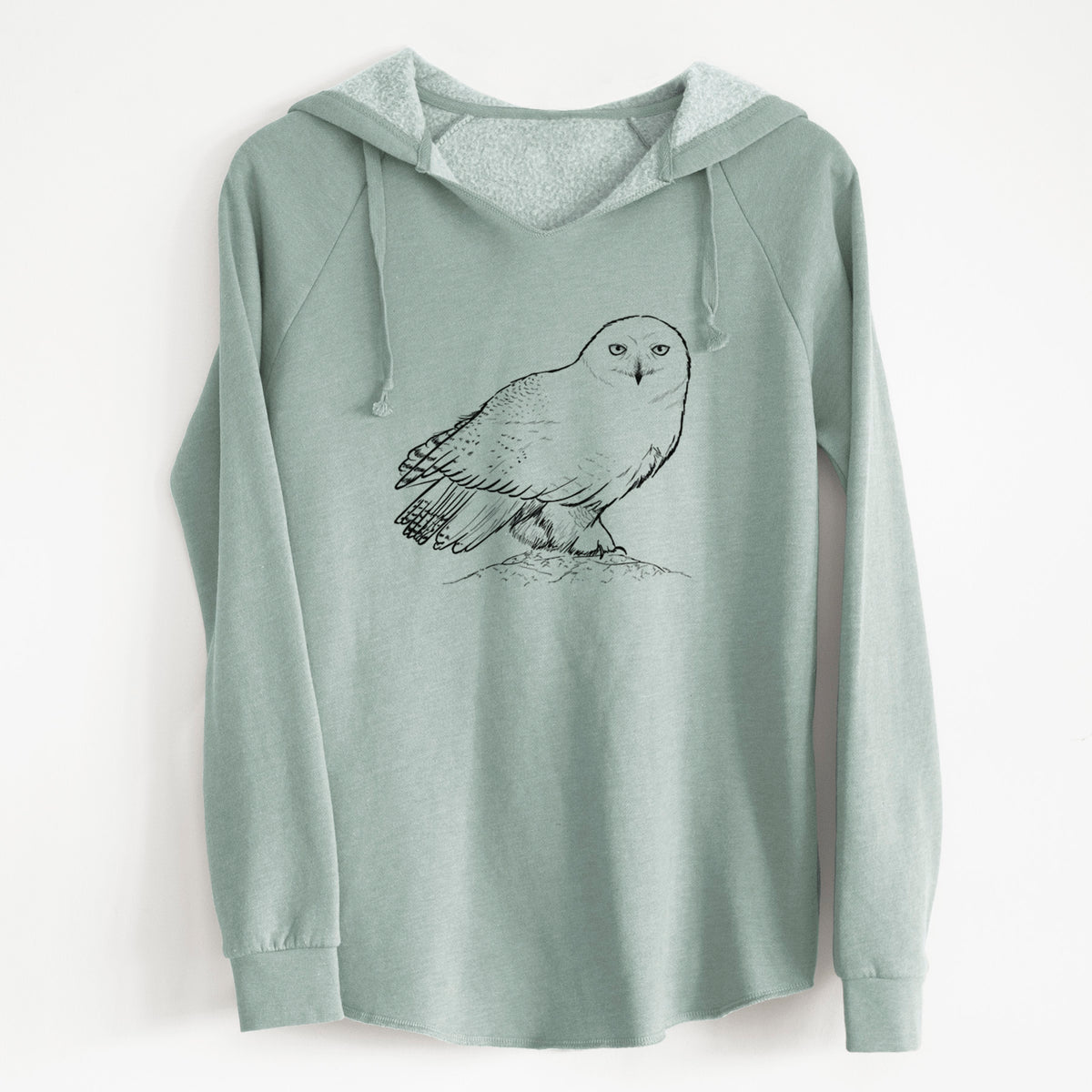 Sage green women's Cali Wave hooded sweatshirt laid flat, printed with a detailed black ink illustration of a snowy owl perched on a snowy mound.