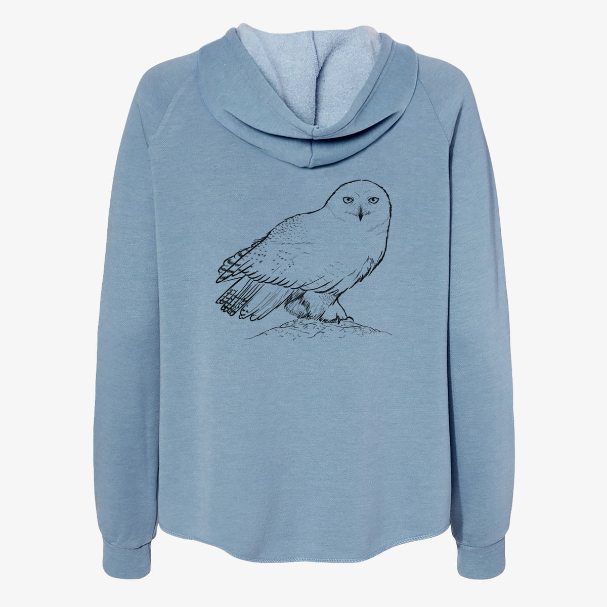 Misty blue women's Cali Wave zip-up sweatshirt laid flat, printed with a detailed black ink illustration of a snowy owl perched on a snowy mound.