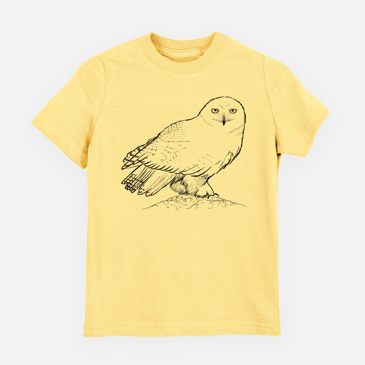 Butter yellow youth t-shirt laid flat, printed with a detailed black ink illustration of a snowy owl perched on a snowy mound.