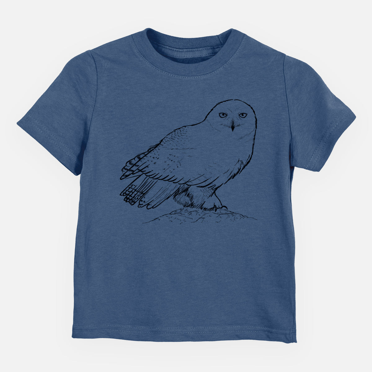 Indigo blue toddler t-shirt laid flat, printed with a detailed black ink illustration of a snowy owl perched on a snowy mound.