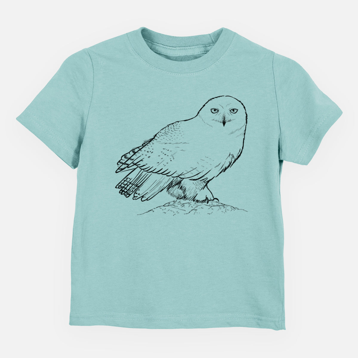Saltwater toddler t-shirt laid flat, printed with a detailed black ink illustration of a snowy owl perched on a snowy mound.