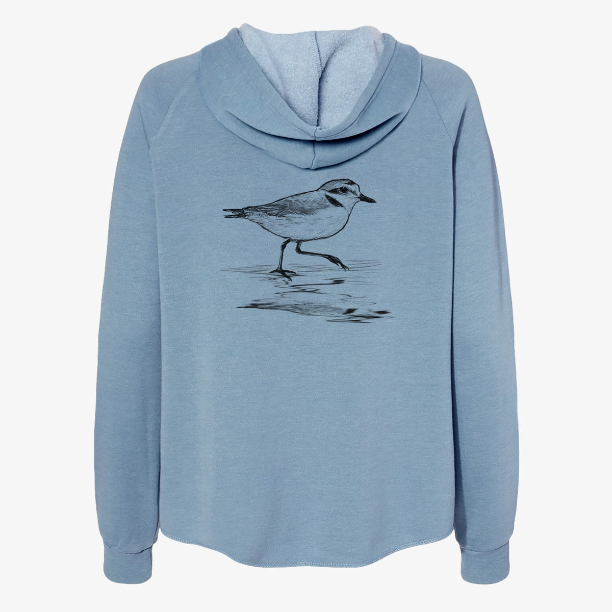 Misty blue women's Cali Wave zip-up sweatshirt laid flat, printed with a black ink sketch of a snowy plover running along the wet shoreline.