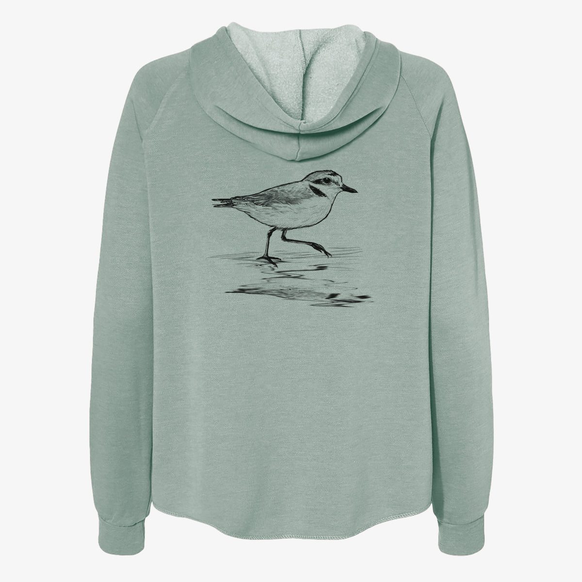 Sage green women's Cali Wave zip-up sweatshirt laid flat, printed with a black ink sketch of a snowy plover running along the wet shoreline.
