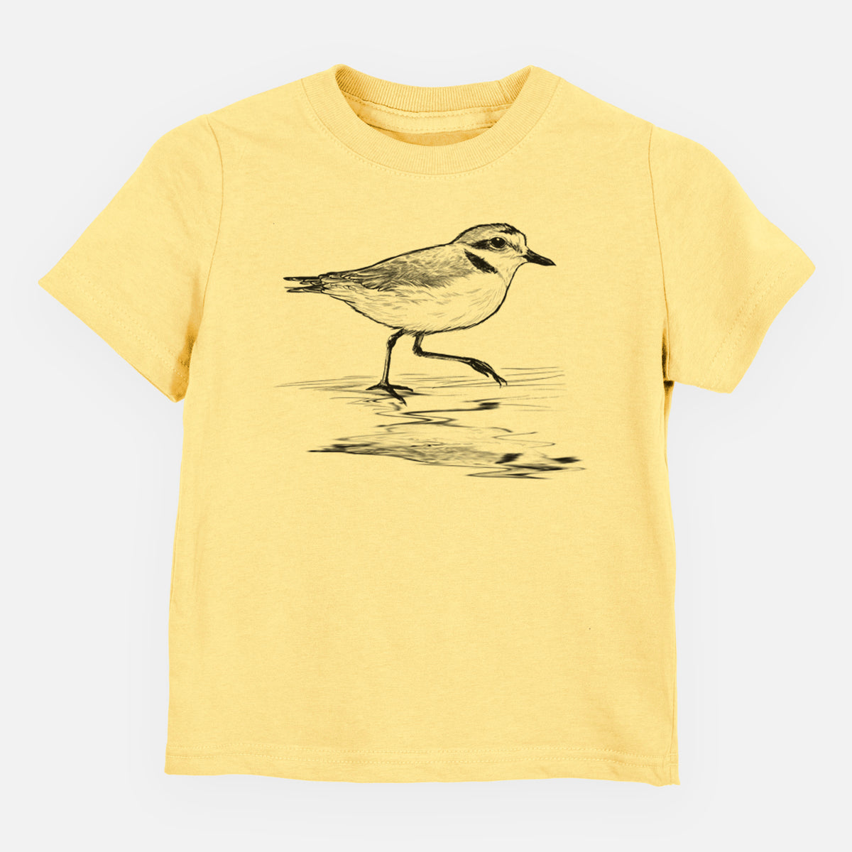 Butter yellow toddler t-shirt laid flat, printed with a black ink sketch of a snowy plover running along the wet shoreline.