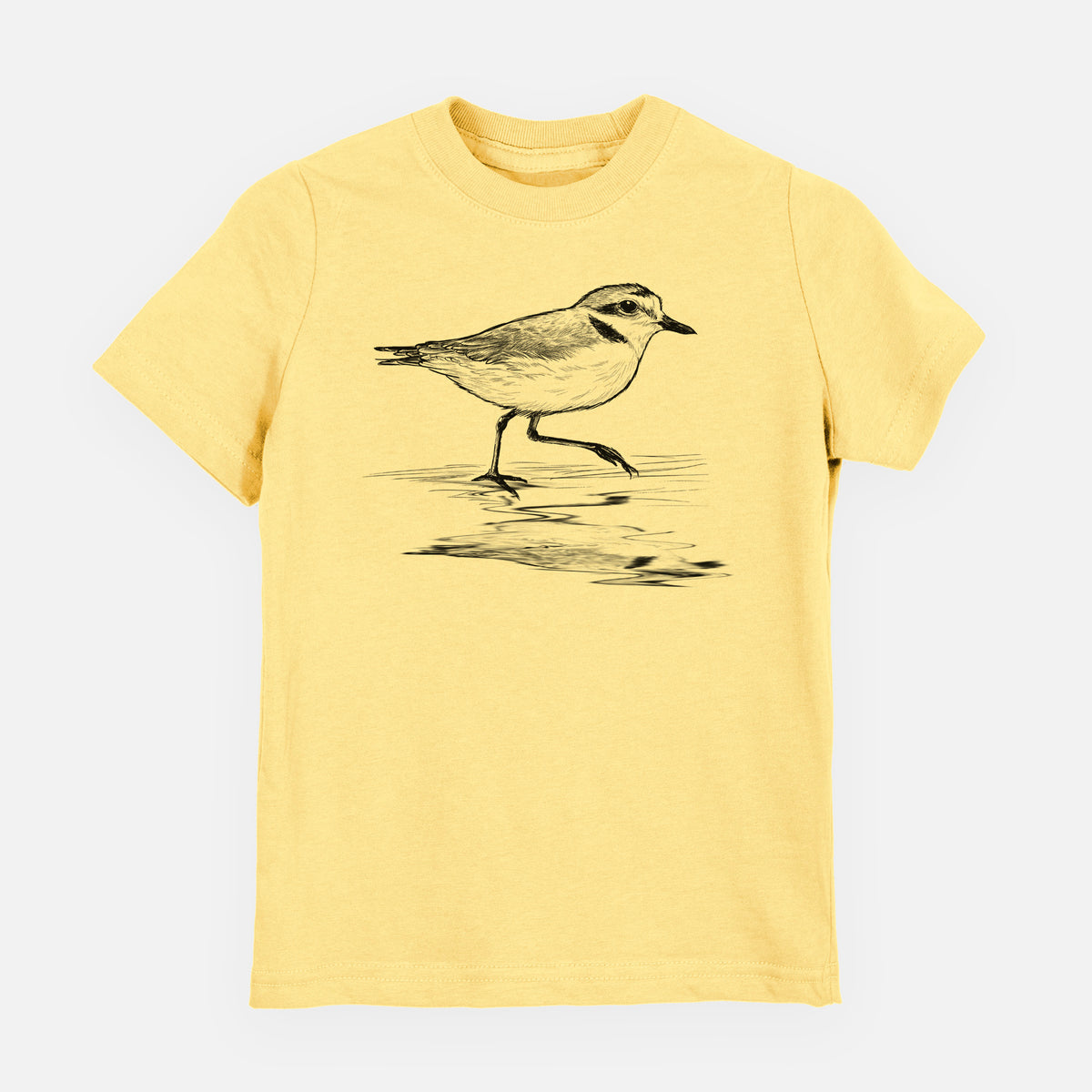 Butter yellow youth t-shirt laid flat, printed with a black ink sketch of a snowy plover running along the wet shoreline.
