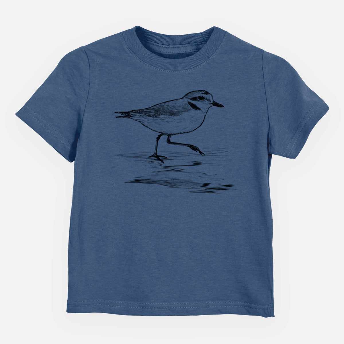 Indigo blue toddler t-shirt laid flat, printed with a black ink sketch of a snowy plover running along the wet shoreline.
