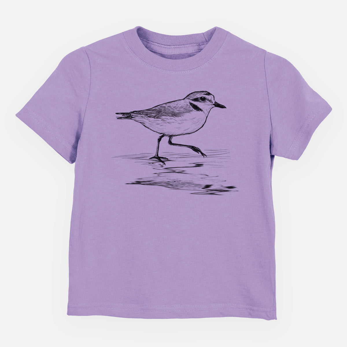 Lavender toddler t-shirt laid flat, printed with a black ink sketch of a snowy plover running along the wet shoreline.