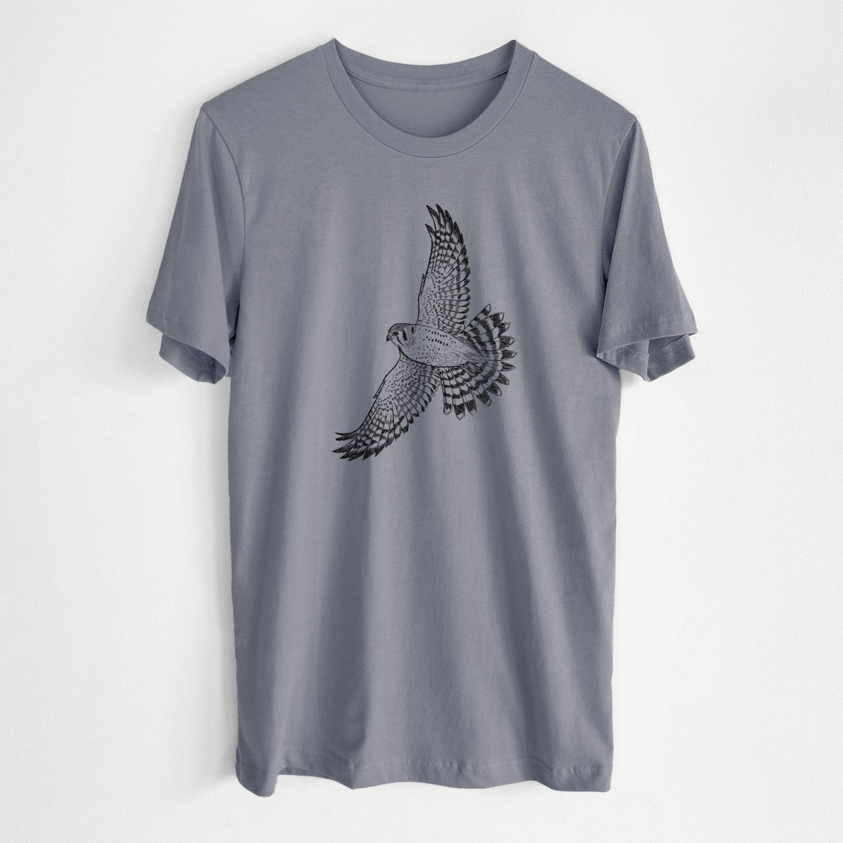 Storm grey lightweight cotton t-shirt laid flat, printed with a detailed black ink illustration of an American kestrel in flight with its wings raised.