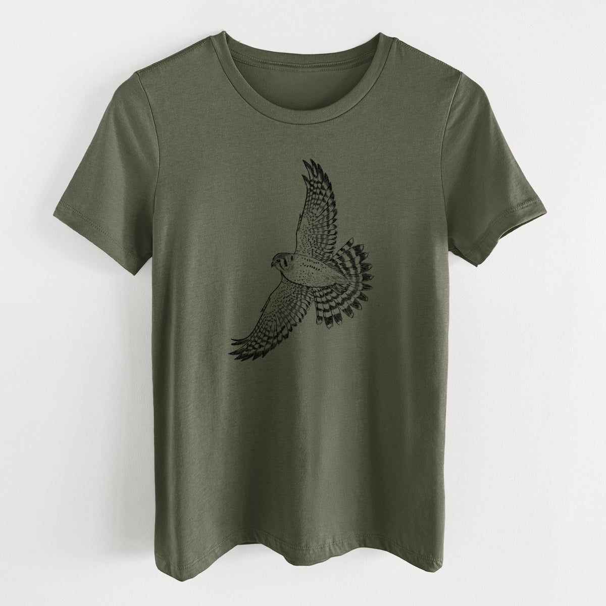 Military green women's relaxed fit cotton t-shirt laid flat, printed with a detailed black ink illustration of an American kestrel in flight with its wings raised.